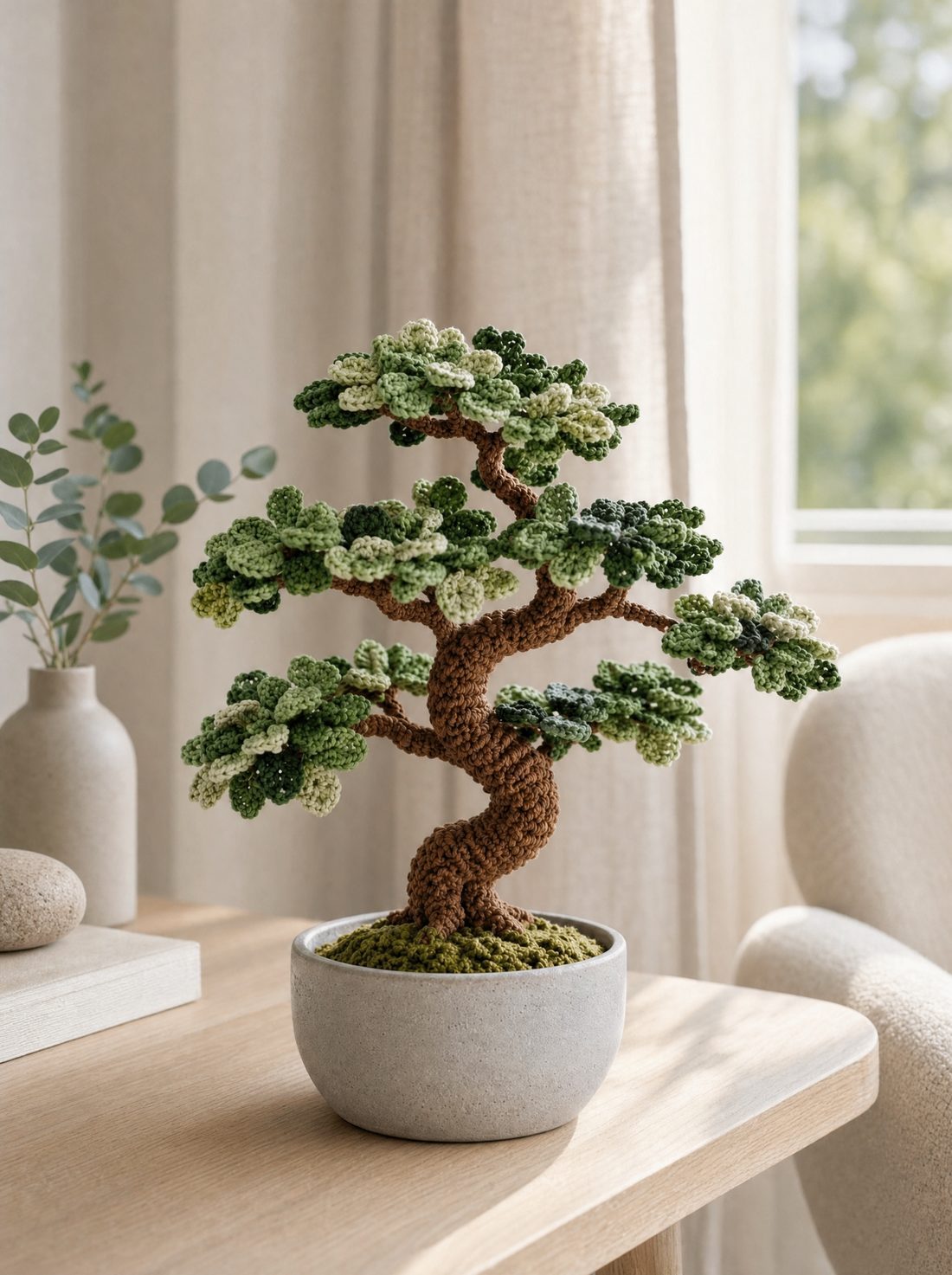 Crochet bonsai tree on a table by a window
