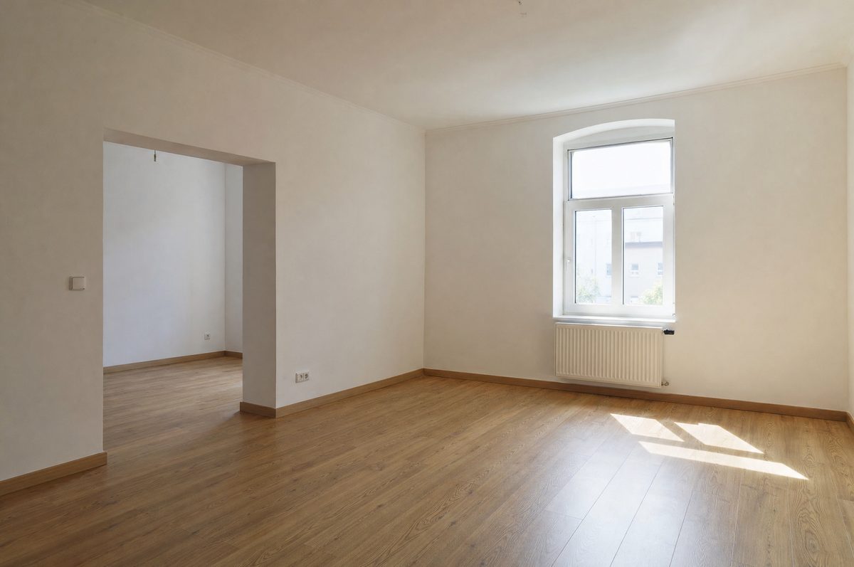 Empty living room, bare walls, daylight